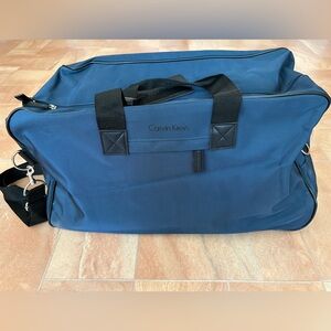 NWOT Calvin Klein Blue & Black Canvas Travel Duffel Bag with Wheels